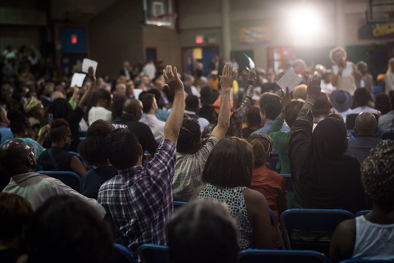 town hall hands up