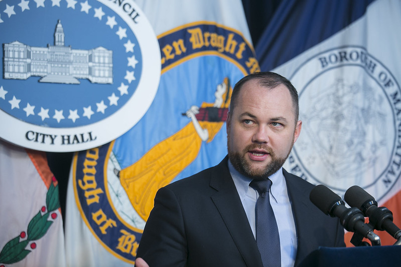 Corey Johnson podium blue room