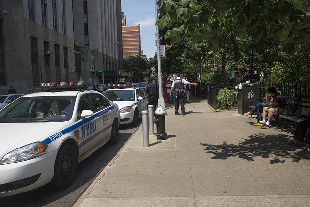 NYPD sidewalk park cars